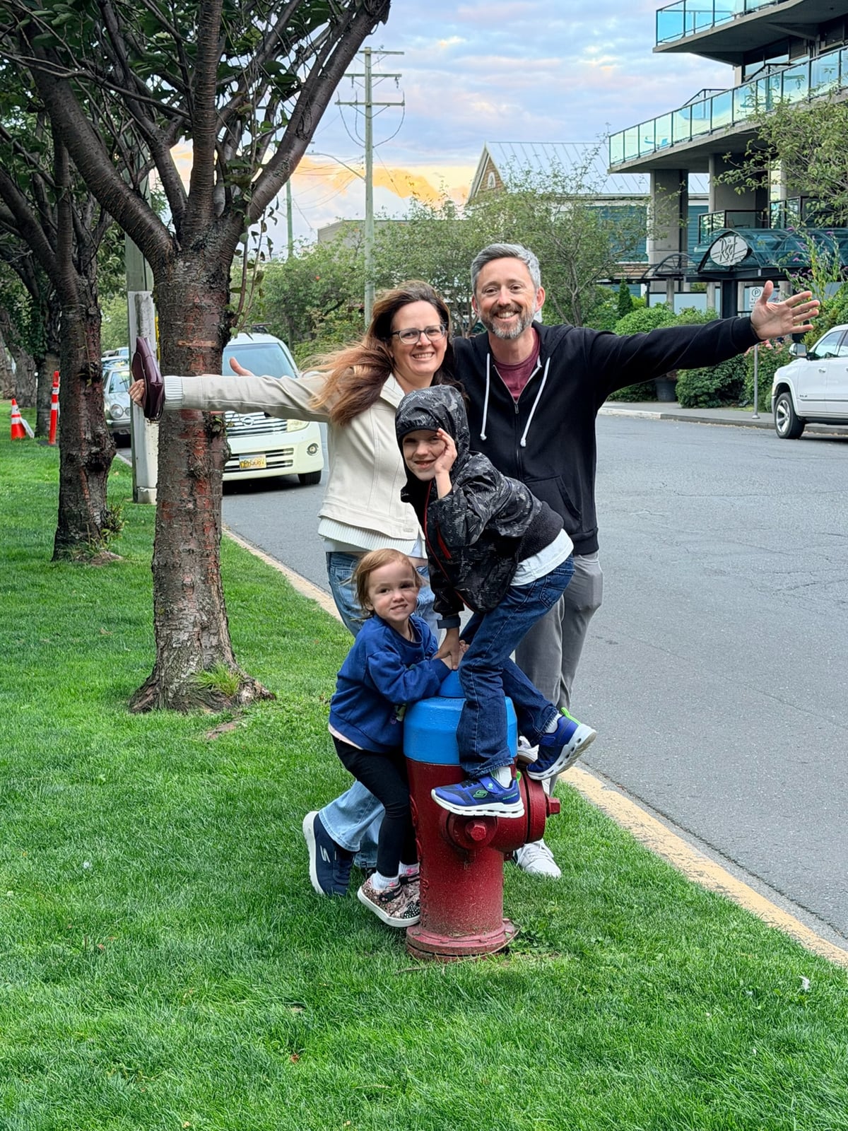 KT and her family striking a pose around a fire hydrant